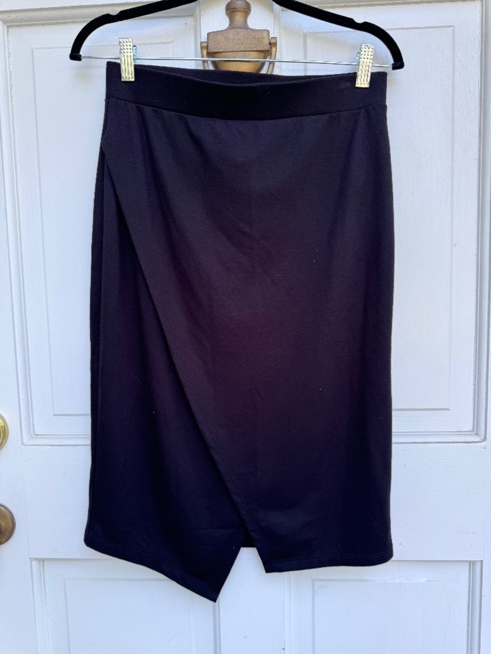 Elegant Banana Republic pencil skirt in classic black, featuring a chic faux-wra